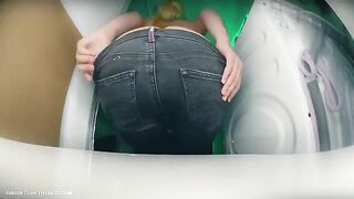 Woman takes a shit on a washing machine