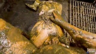Girl plays in a shit-filled pit