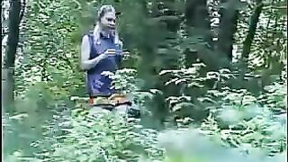 Girl squats and shits into a plastic bag outside