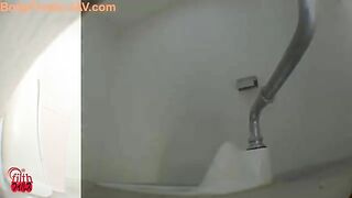 Girl takes a huge dump in a white toilet