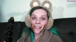 Girl in bear ears eats shit from her hand