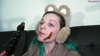 Girl in bear ears eats shit from her hand