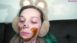 Girl in bear ears eats shit from her hand