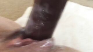Man pisses on another man's ass