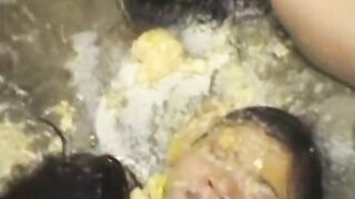 Girl with brown hair gets face full of piss in bathtub