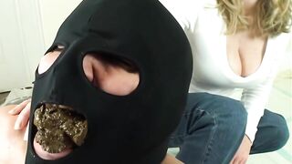 Girl with a hood over her head eats shit from another girl's ass