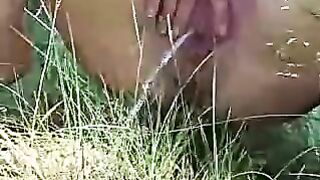 Nude blonde girl takes a massive shit outside in the woods