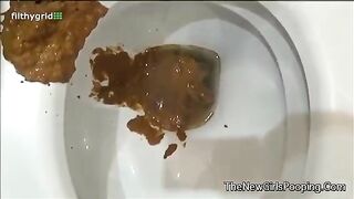 Girl takes a shit in the toilet and plays with it