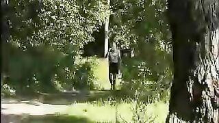 Girl squats in the grass and eats her own shit