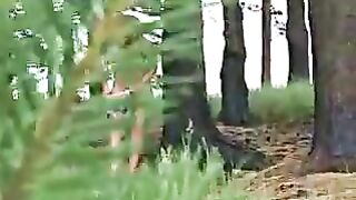 Brunette in woods pulls down shorts and pisses on the ground outside
