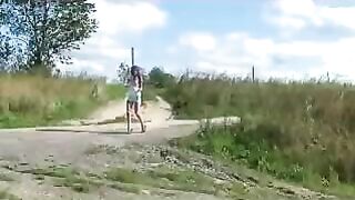 Girl squats to take a shit on the dirt outside