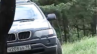 Slut pisses on the ground in the forest
