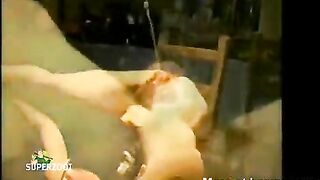Girl pisses in the mouth of a woman lying in a bath