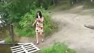 Girl in high heels takes a piss on a dock