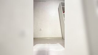 Woman takes a huge shit on a towel on the floor