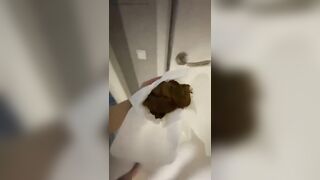 Woman takes a huge shit on a towel on the floor