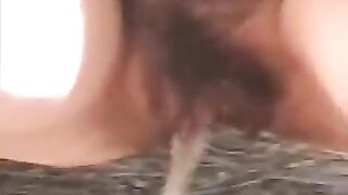 Woman squats on the ground and takes a huge shit