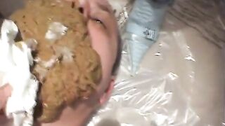 Man eats shit out of a toilet bowl.