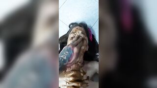 Girl squats, pisses on another girl's face