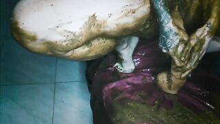 Woman covered in shit sits in a box