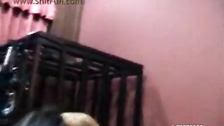 A woman licks shit from another woman's ass while smiling