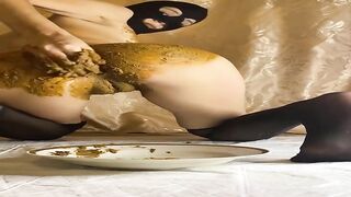 Blonde eats shit from plate on the bed
