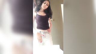 Girl stands over a toilet and takes a huge shit in her pants