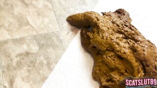 Chick drops a huge log on the floor