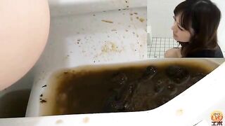 Girl takes a huge shit in a public toilet