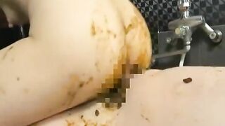 Woman squats and takes a huge shit on the floor, then sits in it
