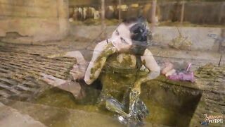 Girl wallows naked in a pit full of shit and piss