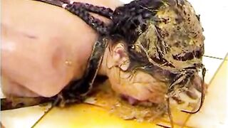 Girl gets her face covered in shit on the floor