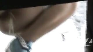 Woman spreads her ass in the mirror