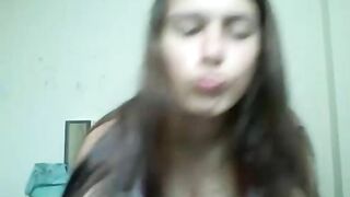 Girl with something around her mouth in webcam video