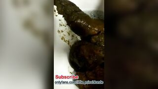 Girl shits in the bathtub and rubs it around with her foot