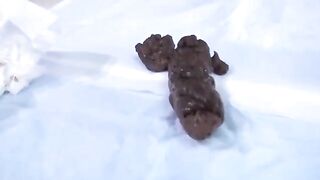Girl in heels squeezes out multiple shits