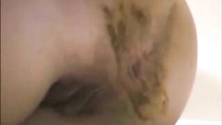 Woman spreads her ass and takes a load of shit