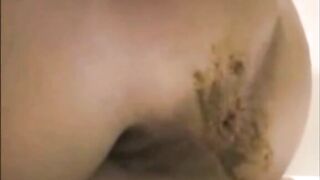Woman spreads her ass and takes a load of shit
