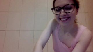 Cute nerdy girl with shaved pussy pissing