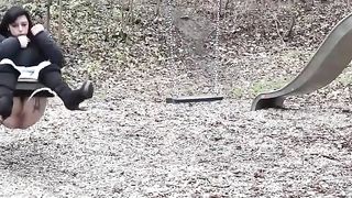 Lady pissing on the swing