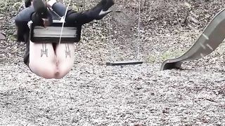 Lady pissing on the swing