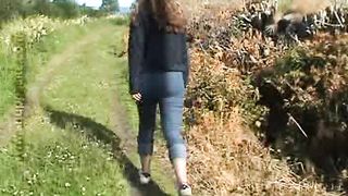 Sexy blonde babe walking in the jungle while pissing