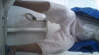 Pretty Asian babe with hairy pussy pooping