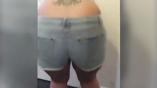 Chubby blonde in shorts pooping in the toilet