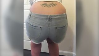 Chubby blonde in shorts pooping in the toilet