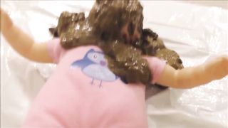 Busty lady pooping on the doll