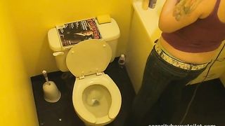 Sexy tattooed brunette chick pooping