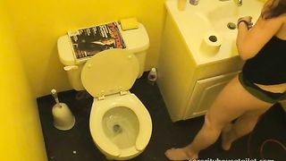 Sexy brunette lady caught pooping in the toilet