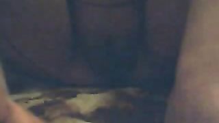 Rubbing her hairy pussy before pissing