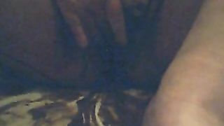 Rubbing her hairy pussy before pissing